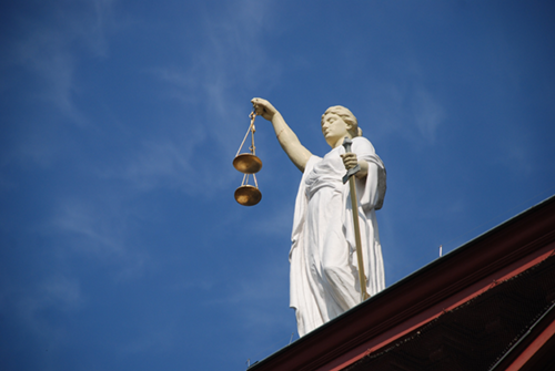 Photo of a statue of Lady Justice holding the scales